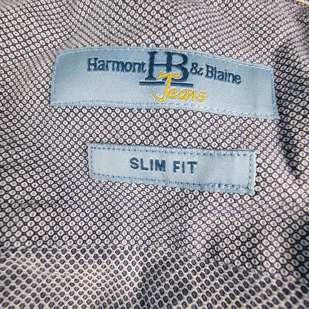 Etichetta azzurra Harmont e Blaine Jeans Slim Fit applicata all'interno del colletto.