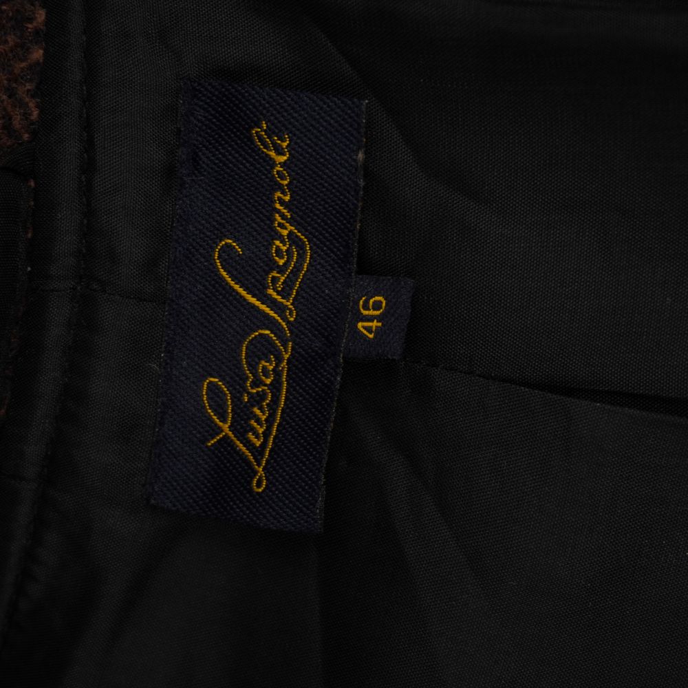  Etichetta vintage blu intrecciata con logo Luisa Spagnoli in oro e indicazione della taglia 46.